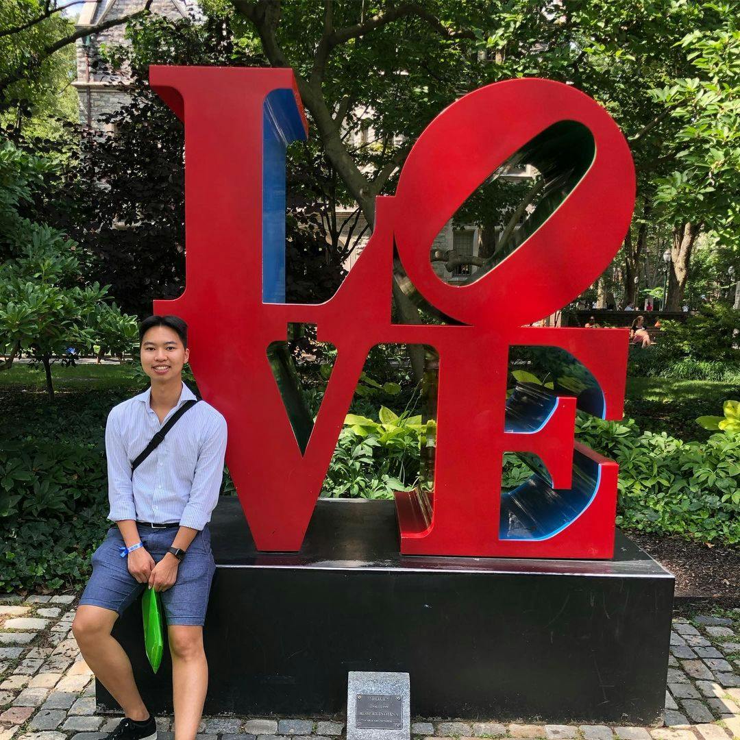 Image of qwertyu_alex in front of some art at UPenn's campus